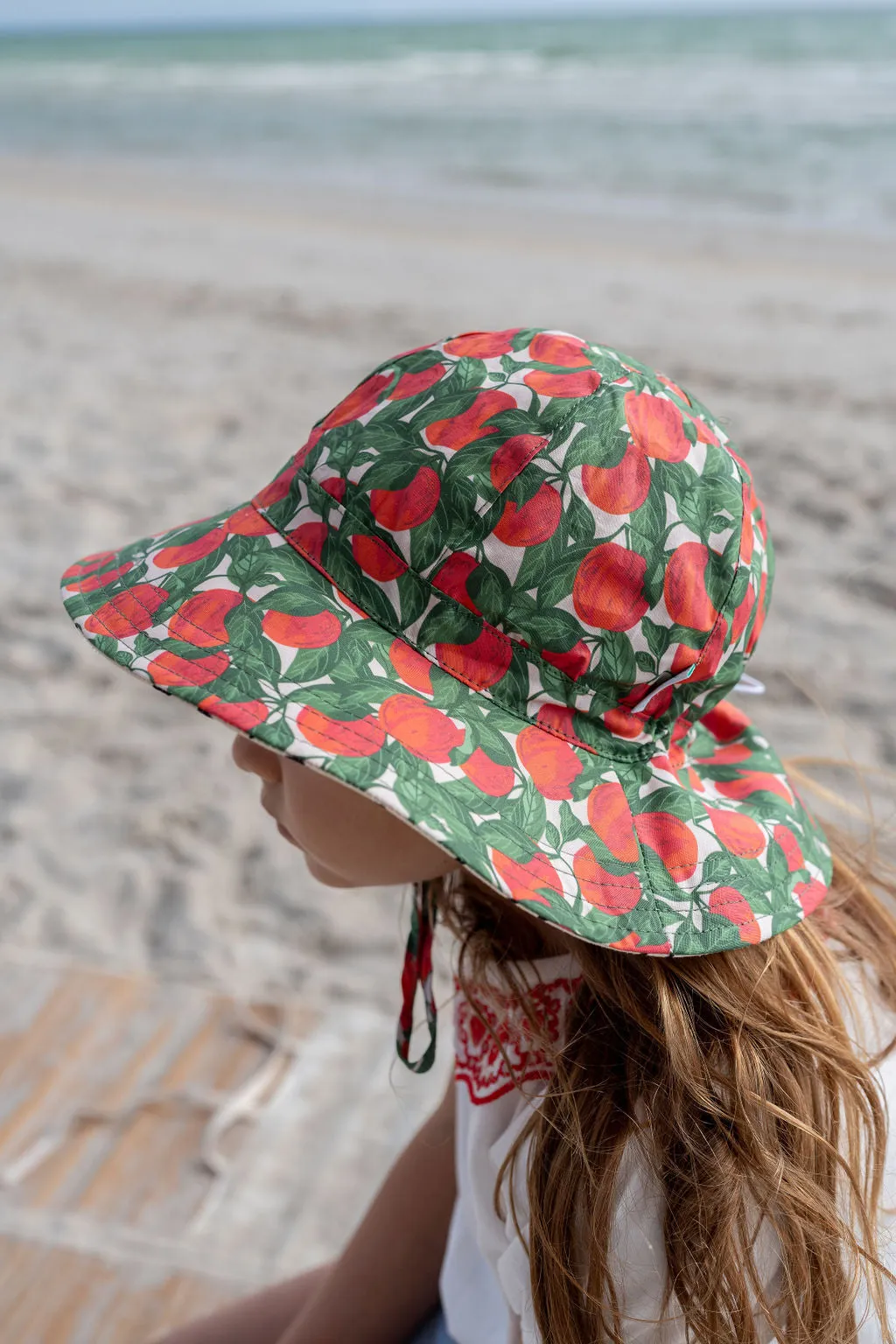 ACORN KIDS - APPLES WIDE BRIM SUNHAT: RED, GREEN AND NATURAL
