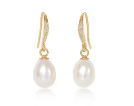 Stella cultured white freshwater teardrop pearl hanging earrings on sparkle gold hooks